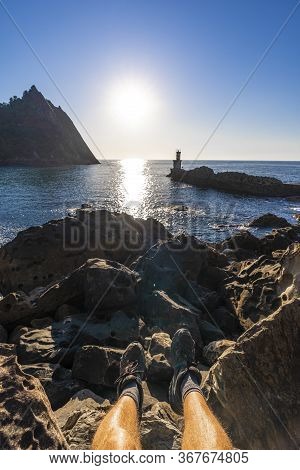 Feet Of A Young Man At The Lighthouse In The Town Of Pasajes San Juan Near San Sebastian. Gipuzkoa, 
