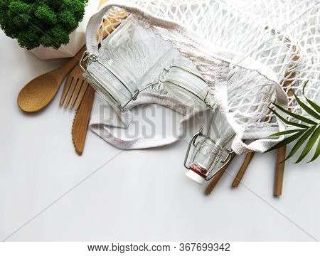Cotton Bags, Net Bag With Reusable  Glass Jars, Bamboo And Wooden Cutlery. Zero Waste Concept. Eco F