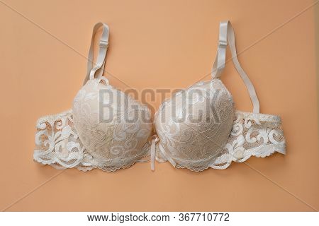 Beige Female Bra With Push Up Top View. Beige Lace Bra Close Up. Women's Sexy Underwear.