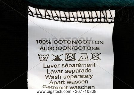 Label With Washing Instructions. White Label With Instructions For The Composition Of The Fabric 100