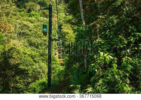 Cable Car Cabins Riding Through The Tropical Rainforest Near The City Of Jaco In Costa Rica