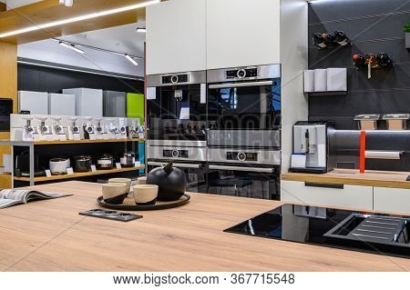 Showroom of domestic appliance store, row of stove top burners and other kitchen stuff