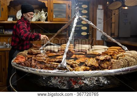 Christmas Market, Berlin, Germany - December 9, 2019 : Spicy Chicken And Pork Meat, Sousage And Stea