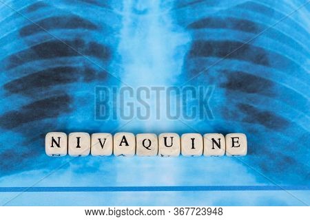 Novel Covid-19, Coronavirus. Infected Lungs Radiology Blue Image Background, With White Pills On It.