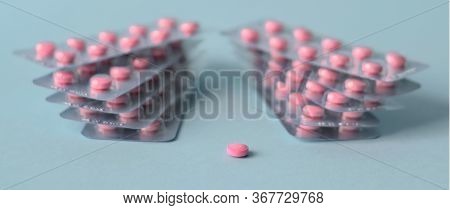 Pills Pink In A Pack On A Blue Background