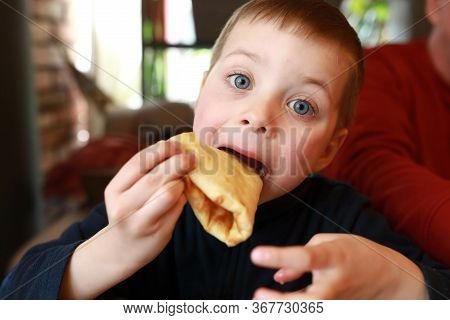 Child Eating Megrelian Khachapuri In Georgian Restaurant