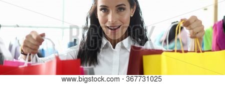 Stylish Girl Shows Off Packages With Purchases. Pick Up All Things So That They Fit Well Together An