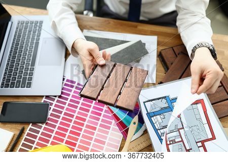 Top View Of Professional Handyman Working With New House Plan. Creative Architect In Stylish Costume