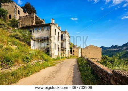 Ruined Buildings Of An Abandoned City. Architecture Of A Ghost Town.