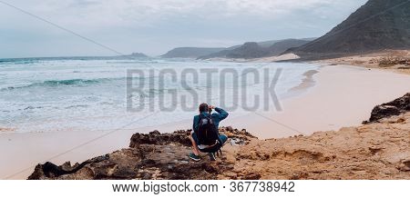 Calhau, Sao Vicente Island Cape Verde. Photographer With Camera In Desert Admitting Unique Landscape