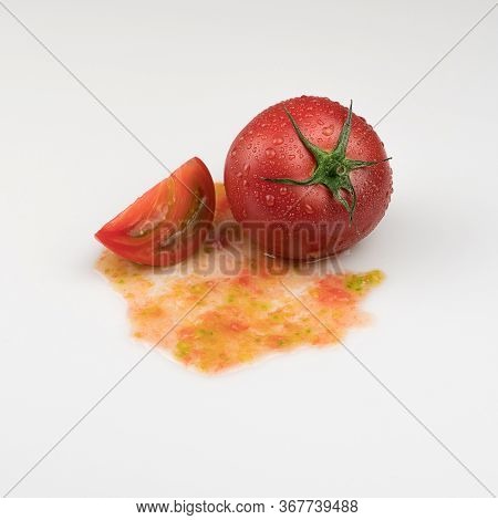 Fresh Wet Tomatoes On A White Background. Sliced Tomatoes With Pulp
