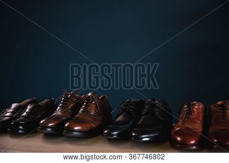 Men Footwear Fashion. Variety Of Male's Shoes On Shelf In House. Formal Leather Shoes, Included Wing