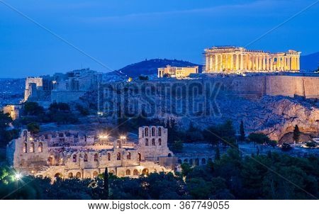 athens seen from Philopapou hill with views to Herodium , Acropolis and the Parthenon at blue hour, Attica, Greece