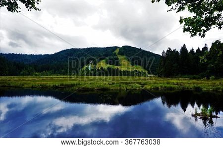 Blue Sky Reflecting In Lispach Lake Near La Bresse, France