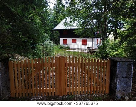 Beautiful Hut With Red Window Blinds Behind Fence Near Le Markstein, France