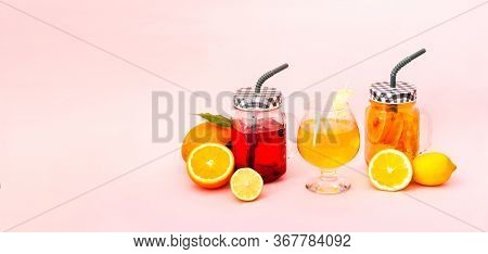 Quarantini Or Homemade Alcohol Drink And Tropical Fruit Cocktails On Pink Background. The Concept Of