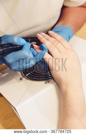 A Girl Is Doing Manicure. A Girl Is Cutting Nails.