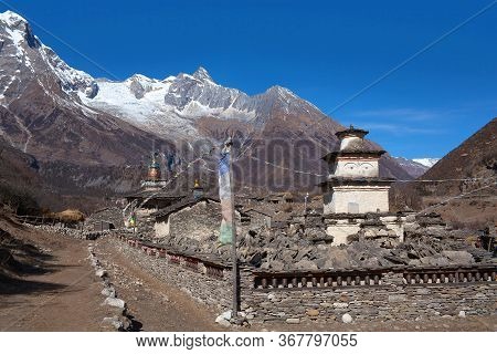 Lho Village In Manaslu Conservation Area In The Nepal Himalaya. Mount Manaslu Is The Eighth Highest 