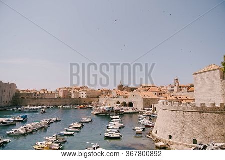The Old Port Harbor Is Porporela, Near The Walls Of The Old Town Of Dubrovnik, Croatia. Moored Boats