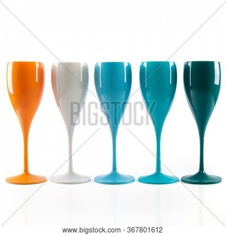 Five mulricolored champagne glasses  for gourmets. Isolated glass cup on wite background for festive events 