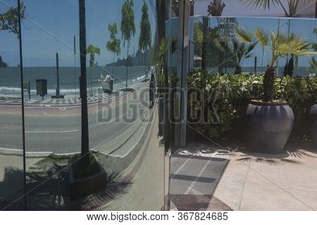Balneario Camboriu, Santa Catarina, Brazil - November 18, 2019: Mirrored Reflection Of The Seashore 