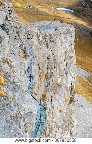 Lauterbrunnen, Switzerland - October 2019: Tourists Walking On The Thrill Walk, The Cliff Pathway Do