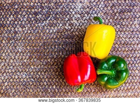 Three Color Peppers On A Beautiful Background,copy Space