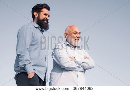 Handsome Senior Men In Blue Shirt. Portrait Of Two Bearded Men. Grandfather Ageing. Male Multi Gener