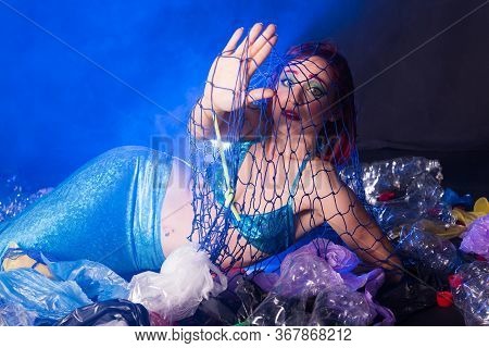 Ocean Plastic Pollution Concept. Mermaid Scared Due To Polluted Habitat.
