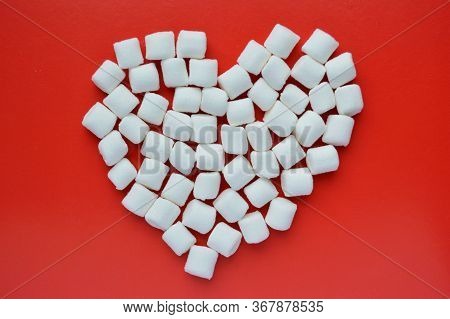 Marshmallows On Red Background With Copyspace. Flat Lay Or Top View. Background Or Texture Of Colorf
