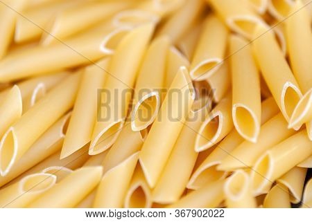 Penne Lisce - Traditional Italian Pasta Of Durum Wheat, Food Background