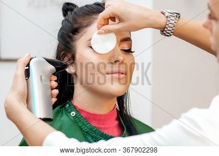 Beautiful Young Brunette Woman Receiving Airbrush Professional Makeup With Aerograph With Aerograph 