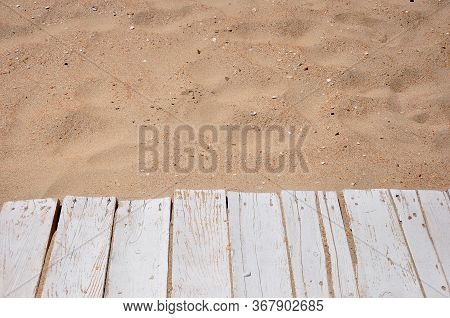 Empty Wooden Walking Path On The Sea Coast Sandy Tropical Beach Background