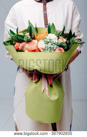 Bouquet Of Flowers In Lime Color Foamiran Package In The Hands Of A Woman Florist. Rose, Hydrangea, 