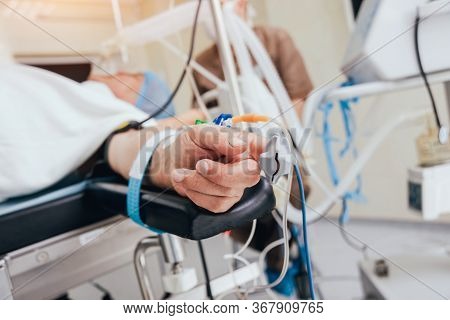 Pulse Oximeter On The Patients Hand. Surgery Equipment.