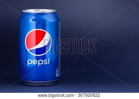 Belgorod , Russia - MAY, 17, 2020: Pepsi drink in a can on ice isolated on blue background. Carbonated soft drink produced by PepsiCo.