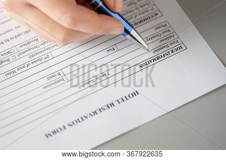 Woman Filling Hotel Reservation Form Putting First Name. Reception Desk. Hotel Service, Registration