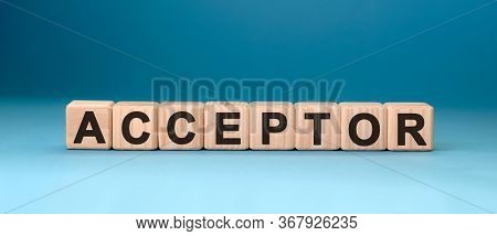 Acceptor - Text Concept On Wooden Cubes With Gradient Blue Background