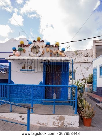 Agaete, Las Palmas - October 17, 2019: Aged House Against Blue Sky With Clouds In Agaete, Las Palmas