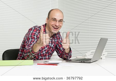 Successful Casual Man Showing Thumbs Up In Office