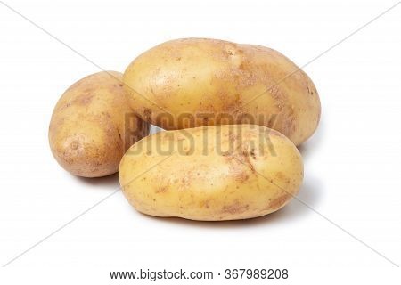 Several Potato Tubers On A White Isolated Background. Fresh Vegetables. Yellow Potatoes.