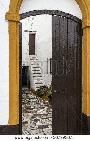 Looking Inside The Open Gate Of A House, Ayamonte, Spain.