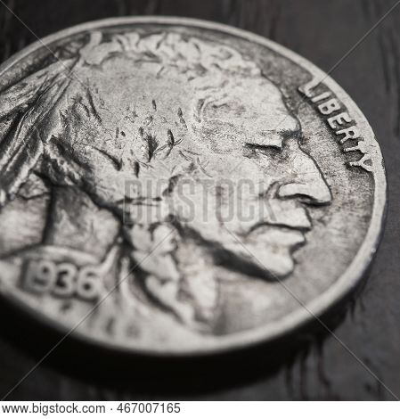 Us Nickel Lies On A Dark Table Surface. Coin 5 Five Cents Close Up. Indian Head Nickel. News About U