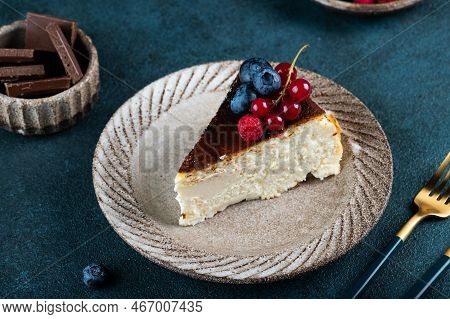 Piece Of San Sebastian Basque Cheesecake With Berries. Basque Cheesecake. Popular Dessert. Burnt Che