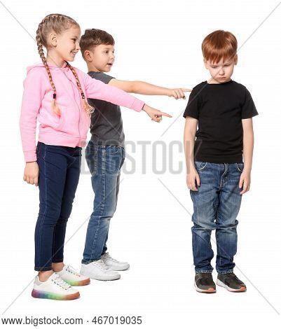 Kids Pointing At Upset Boy On White Background. Children's Bullying