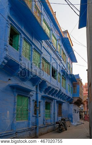 Jodhpur, Rajasthan, India - October 21st, 2019 : Traditional Blue Coloured House With Green Colour W