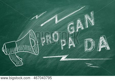 Propaganda And Fake News Concept. Illustration On Greenboard. A Megaphone With The Word Propaganda. 