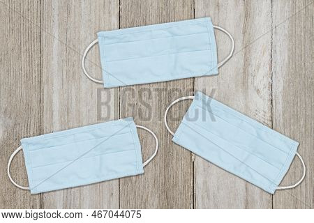 Three Face Masks On Weathered Wood For Your Triple Demic Message