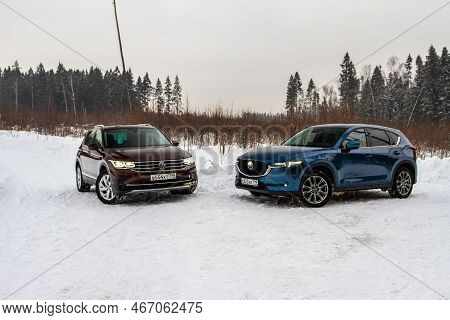 Moscow, Russia - January 22, 2022. Volkswagen Tiguan (ad1) 4motion, And Mazda Cx5 (kf) Skyactive, Su