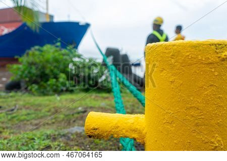 Two Supervisors Watching The Departure Of A Cargo Ship At A Caribbean